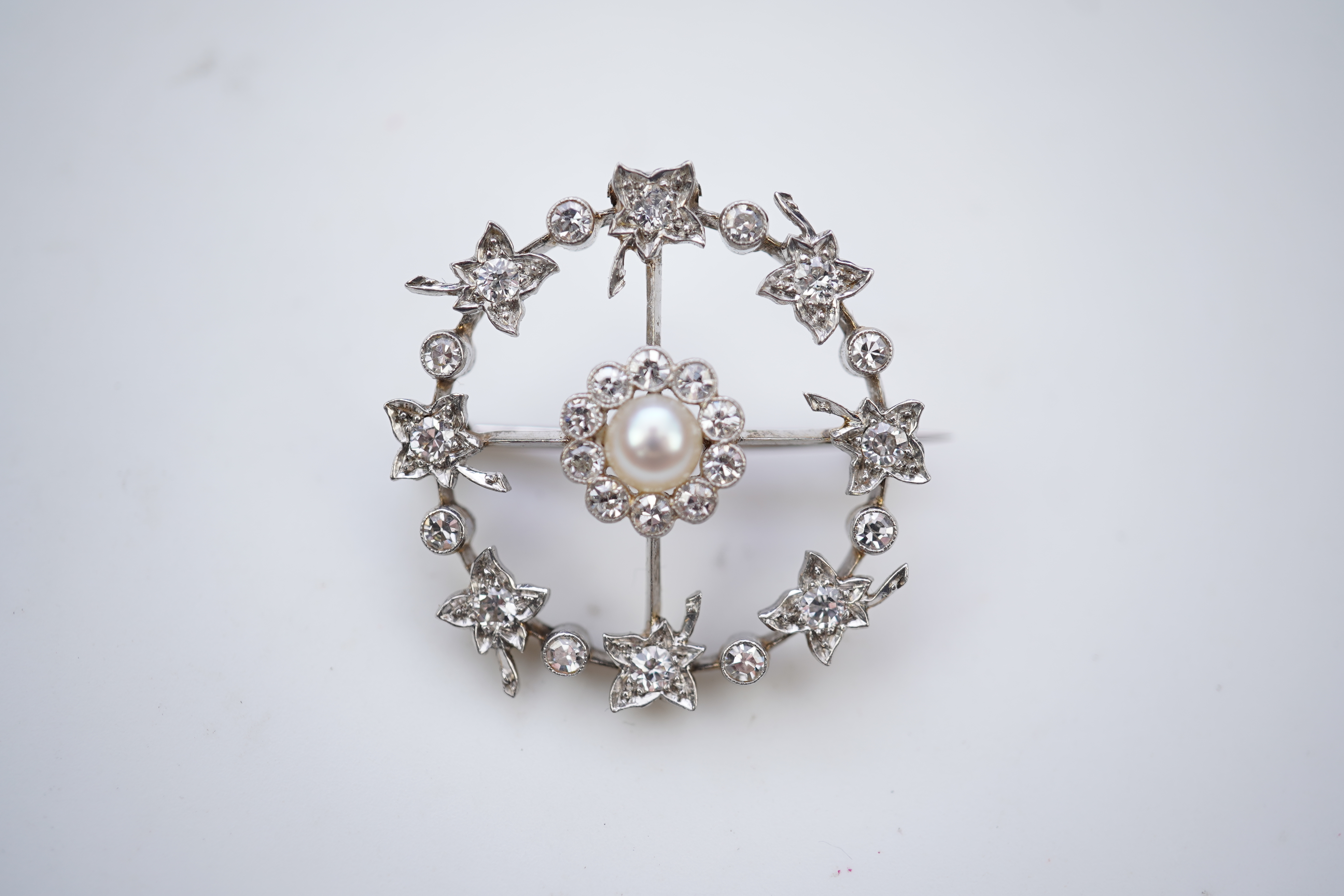 An attractive Edwardian pearl and diamond brooch, circa 1910